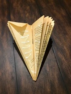 an origami book page folded into a triangle