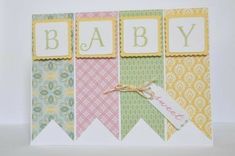 a card with the word baby on it and some tags attached to it that spell out its name