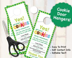 two door hangers with the words yes cookies on them and a pair of scissors