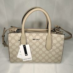 Nine West Allyce Handbag Purse Nyc532906 Mushroom Logo With Triple Entry And 2 Slip Pockets. 19" Adjustable Shoulder Strap And 8" Handle Drop. Magnetic Snap Closure. Faux-Leather In Beige Color With 9 Design Exterior. New With Tags. Nine West Bags Handbags, Cream Shopping Bag With Adjustable Handle, Cream Bags With Adjustable Handle For Shopping, Neutral Top Handle Bag With Detachable Handle, Cream Rectangular Satchel With Adjustable Handle, Neutral Satchel Bag With Detachable Handle, Cream Satchel For Office, Rectangular Neutral Satchel For Shopping, Neutral Rectangular Satchel For Shopping