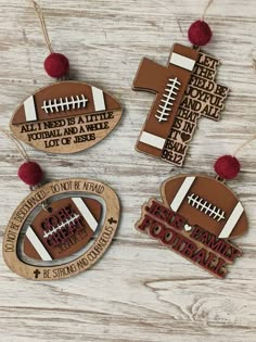 three wooden ornaments with footballs on them