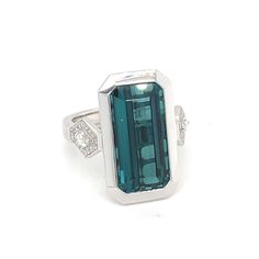 For Sale on 1stDibs - This baguette indicolite tourmaline has bezel setting in white gold. East west has accent diamond. Carefully crafted with skilled artisan this ring design Indicolite Tourmaline, Gold Cocktail Ring, Gold Cocktail, East West, Cocktail Ring, Bezel Setting, Cocktail Rings, Diamond White, Ring Designs