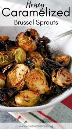 a white bowl filled with brussel sprouts on top of a table