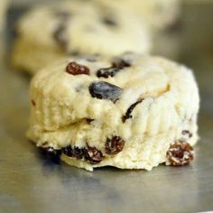 two chocolate chip cookies sitting on top of a counter