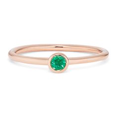 Add a petite pop of color to any look with this natural emerald ring. Crafted in vivid 14-karat rose gold  it features a stylish bezel setting. Wear it solo  or add it to your favorite ring stack. To care for natural emeralds  gently clean with mild soapy water and a soft cloth. Avoid harsh chemicals  ultrasonic jewelry cleaners  and extreme temperature changes. Rose Gold Solitaire Emerald Ring, Green Bezel Setting Stackable Rings, Emerald Birthstone Ring With Bezel Setting, Emerald Ring With Bezel Setting, Emerald Promise Ring With Bezel Setting And Round Band, Minimalist Emerald Ring With Bezel Setting, 14k Rose Gold Rings With Bezel Setting, Ultrasonic Jewelry Cleaner, Natural Emerald Rings