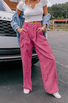 - These corduroy pants have trendy style and flair! - Unlined corduroy material - A high waistline with belt loops, a hidden zip fly, and button closure - Functional side pockets as well as low buttoned cargo style pockets - Back faux pocket accent flaps - A relaxed silhouette that ends in wide floor length hemlines High Waist Corduroy Pants With Pockets, Trendy Corduroy Bottoms With Pockets, Purple Corduroy Bottoms With Pockets, Casual Purple Corduroy Bottoms, Pink Wide Leg Corduroy Pants, Pink Corduroy Pants For Fall, Pink High Waist Corduroy Bottoms, Corduroy Cargo Pants, Corduroy Material