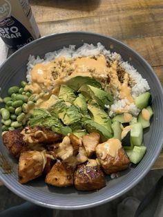 a bowl filled with rice, meat and veggies