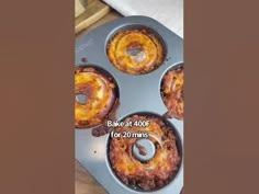 four baked pastries sitting in a pan on top of a table