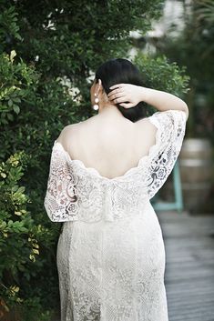 the back of a woman in a wedding dress