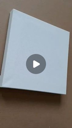 an open box with a play button on it