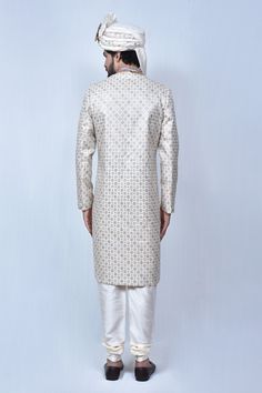 Multicolor sherwani with floral embroidered motifs and welt pocket in front. Comes with cream churidar.
Components: 2
Pattern: Embroidery
Type Of Work: Thread
Neckline: Mandarin Collar
Sleeve Type: Long
Fabric: Art Silk, Silk Blend
Color: Multi Color
Other Details: 
Welt pocket in front
Slits on the sides
Closure: Button front
Note: The mala and safa worn by the model is not for sale
Occasion: Groom - Aza Fashions Cream Straight Kurta Bandhgala For Diwali, Cream Bandhgala Straight Kurta For Diwali, Designer Cream Kurta With Dabka Detailing, Designer Cream Kurta With Dabka, Designer Off White Kurta For Eid, Off White Straight Kurta Sherwani For Festive Occasion, Designer Off White Kurta With Resham Embroidery, Festive Off White Sherwani With Straight Kurta, Designer Off-white Kurta For Eid