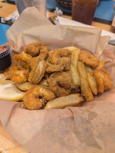 some fried food is in a basket on a table