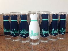 six shot glasses with the names of different women and men on them, lined up next to each other