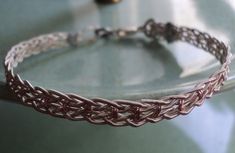 a close up of a bracelet on a table