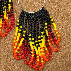 Flaming hot versatile beaded earrings to add flair to your Halloween outfit and even after into the fall season, they would make a nice gift for someone special. Don't forget someone with a fire sign or element. Each beaded earring is meticulously made one bead at a time. No two are ever the same. They hang at 3 3/4 inches including the ear wire and are about 1 inch wide. Red Beaded Earrings With Colorful Beads For Festivals, Fire Color Beaded Earrings, Orange Beaded Earrings Native American, Neon Beaded Earrings Native American, Nickel-free Orange Beaded Dangle Earrings, Flaming Hot, Fire Signs, Beaded Earring, Red Orange Yellow