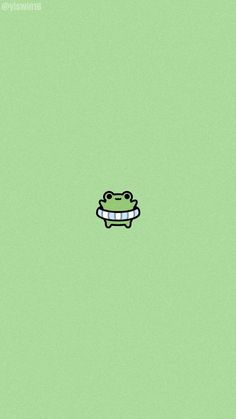 a frog with a ribbon around it's neck on a light green wallpaper