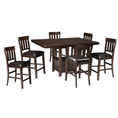 a wooden table with four chairs and a brown dining room set on top of it