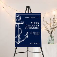 a welcome sign with an anchor on it for a wedding or retirement party in blue and white