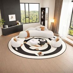 a modern living room with black and white decor on the floor, couches and rugs