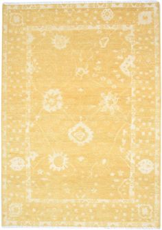 an area rug with yellow and white colors