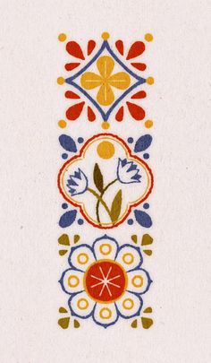 an embroidered design with flowers and leaves on white paper, in the shape of a rectangle