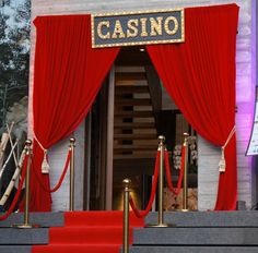 red carpeted steps leading up to a casino entrance