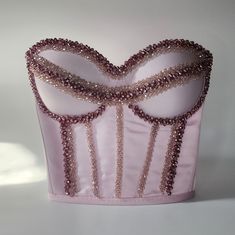 Make a bold fashion statement with our Handmade Rhinestone Crystal Embellished Pink Corset Bustier Party Top! This glamorous piece is the perfect blend of elegance and sparkle, designed for those who love to stand out. The bustier is adorned with hand-applied rhinestones and crystals, creating a dazzling effect that catches the light beautifully. Crafted from high-quality materials, this pink corset bustier offers a flattering fit that enhances your natural curves. It's perfect for parties, even Bridal Corset Top, Beaded Corset Top, Neon Forest, Crystal Corset, Rhinestone Corset, Embellished Corset, Pink Bustier, Bridal Corset, Hair Upstyles