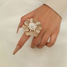 The ring is made from gold-plated over brass and set with lovely resin pearls, featuring a large flower design. This subtle back-to-basics accessory will be an excellent gift for a woman in your life. It would be perfect for Mother's Day, Wedding Day, Birthday, Anniversary or any other occasion. 👌 M A T E R I A L• Gold-plated Brass• Resin Pearls• This product is hypoallergenic (nickel free) and tarnish resistant 📏 S I Z E• Length: 5.6 cm (2.2 inch)• Weight: 6.8 g Fashion Romantic, Color Rings, Romantic Fashion, Costume Jewelry Rings, Adjustable Jewelry, Wedding Party Jewelry, Party Rings, Bff Gifts, Women Ring