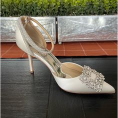 Soft White Satin Embellished Buckle Mp6606 Style: Pointed Toe 2 Piece Heel Type: Stiletto Heel Height:3.35” Material: Silk Satin Man Made Sole Embellished Ankle Strap Wedding Shoes For Gala, Elegant Bedazzled Heels For Wedding, Elegant Embellished Heels For Wedding, Elegant Embellished Ankle Strap Wedding Shoes, Elegant Rhinestone Wedding Shoes For Reception, Elegant Rhinestone Wedding Shoes, Elegant Rhinestone Wedding Reception Shoes, Champagne Embellished Ankle Strap Wedding Shoes, Embellished Ankle Strap Wedding Shoes For Reception