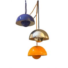 two different colored lamps hanging from the ceiling