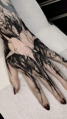 a woman's hand with black ink on it