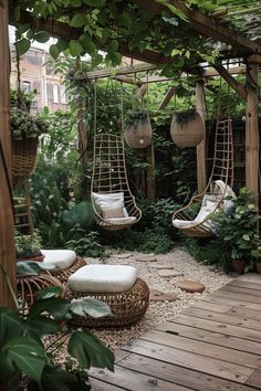 an outdoor area with hanging chairs and plants