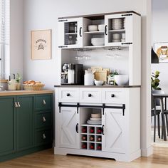 a kitchen with green cabinets and white cupboards