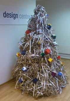 a christmas tree made out of sticks and magnets