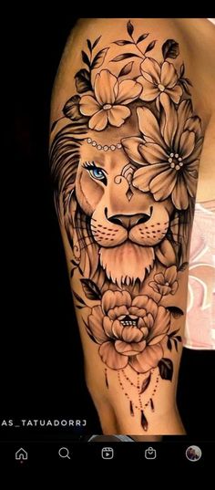 a woman's arm with flowers and a lion tattoo on the left side of her body