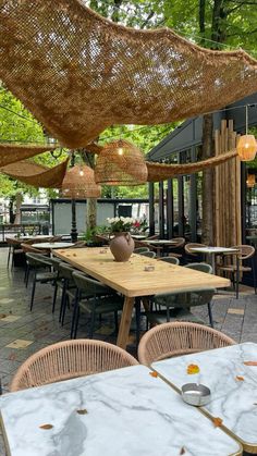 an outdoor dining area with tables and chairs