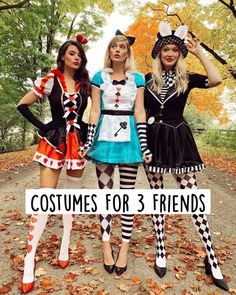 three women dressed up in costumes for halloween