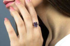 A look of luster and elegance, this solitaire ring flaunts an Amethyst stone. A simple yet classy adornment for a special event, this is perfect for a timeless look. A charming gift jewelry you can choose as a promise ring, anniversary present, or birthday treat for a February-born lady. ☛ 𝒜𝐵𝒞 - Add Engraving - https://etsy.me/3CLxYPZ ☛ Ring size - Select the size you would like from the drop down menu ♥ Gemstone Type - Amethyst (Lab Created) ♥ Gemstone Size - 7x11mm ♥ Gemstone Cut - Rectangl Elegant Rectangular Amethyst Ring, Square Cut Amethyst Ring For Formal Occasions, Modern Radiant Cut Gemstone Ring, Formal Square Cut Amethyst Ring, Classic Solitaire Ring With Rectangular Stone, Elegant Purple Sapphire Solitaire Ring, Elegant Purple Solitaire Sapphire Ring, Elegant Rectangular Birthstone Ring, Classic Amethyst Ring With Rectangular Stone For Formal Occasions