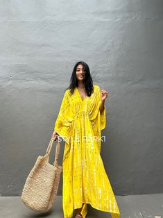 "Uluwatu Kaftan dress\" Soft, Smooth, Lightweight Rayon voile Fabric. Perfect for Elegant Day and Nightwear or worn as a cover-up for that beach or poolside statement of glamour. And for Muslim women   Color - Bali  Tie Dyed Lemon yellow & multi motif Measurements in CM and Inches.  Size American measurement is Medium to Large.  It fits all the body sizes between M to2XL Size - One size fits all American size From M to 2XL Total wide /240cm/94inch(round) Chest & him /180cm/70inch(round) The length /140cm/55inch We recommend all types of ladies you can surly accessorize with it to create your glamorous looks.  👉Please choose carefully Color & Size 👈  Iphone 14Photos therefore, the color can be slightly different between the real products and photos." Yellow Free Size Kaftan For Beach Cover-up, Festive Floor-length Yellow Kaftan, Yellow Maxi Length Kaftan For Beach Cover-up, Summer Vacation Tie-dye Kaftan, Dress Luxury, Bohemian Tie Dye V-neck Kaftan, Arab Fashion, Kaftan Dress, Muslim Women