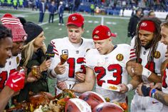 some football players are standing together on the field