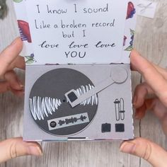 two hands holding up a card that says i know i sound like a broken record but i love love you