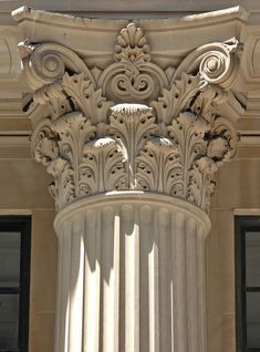 an ornate column on the side of a building