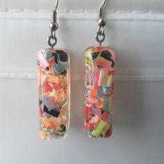 This is a beautiful pair of confetti earrings, made with resin. Very cute Shipping is registered I can combine shipping for multiple items Playful Resin Dangle Earrings, Fun Resin Drop Earrings, Fun Resin Dangle Earrings, Multicolor Glass Drop Earrings, Artsy Resin Drop Earrings, Trendy Multicolor Resin Earrings, Party Earrings In Multicolor Glass, Multicolor Resin Drop Earrings, Handmade Multicolor Resin Earrings