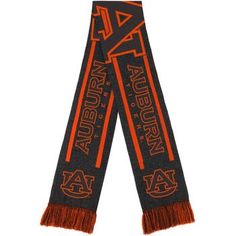 an orange and black scarf with the auburn university logo on it's fringes