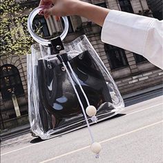 Transparent / Clear Tote Bag In Black 2 In 1 Style. Clear Handbag As A Purse Inside. Material: Pvc. Dimensions : Hand Tote Bag, 9.4in’’(L)*8.2in’’(H)*3.9in’’(W) , Small Purse :8.9in’’(L)*7in’’(H) Everyday Clear Bag, Clear Strap Satchel Bag, Black Shoulder Bag With Clear Strap, Trendy Black Shoulder Bag With Clear Strap, Chic Clear Bags With Detachable Strap, Chic Clear Bag With Detachable Strap, Black Shoulder Bag With Clear Strap For Daily Use, Black Handheld Bucket Bag For On-the-go, Chic Black Shoulder Bag With Clear Strap