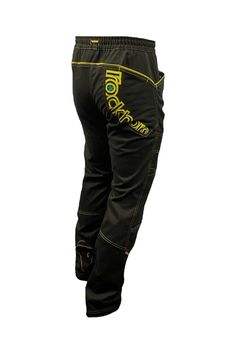 a pair of black pants with yellow writing on the bottom and one leg is shown