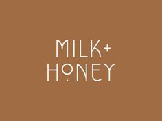 the words milk and honey written in white on a brown background