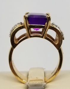 "We do not check prongs for wear or stones for looseness. All items are sold as is-noting that we are a resale shop so everything here had a previous owner! We will include flaws in the description when noted. This is one of the reasons our items are more affordable than new at a jewelry store. Vintage 14K Yellow Gold Ring with Diamonds and a Large Amethyst, Size 7. Stamped 14K twice inside band. Weighs 6.2 dwt. Please stop in often as we will be adding additional vintage fine jewelry beauties. Emerald Cut Hallmarked Amethyst Ring, Fine Jewelry Amethyst Ring Stamped 14k, 14k Stamped Purple Amethyst Ring, Emerald Cut Amethyst Ring In Yellow Gold For Anniversary, Purple 14k Stamped Ring, Hallmarked Emerald Cut Amethyst Ring In Fine Jewelry Style, 14k Stamped Amethyst Ring For Anniversary, Fine Jewelry Hallmarked Emerald Cut Amethyst Ring, Fine Jewelry Emerald Cut Hallmarked Amethyst Ring