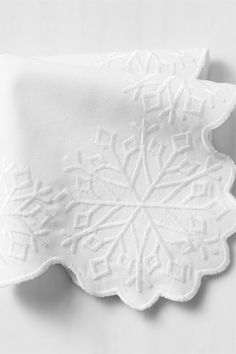 a white napkin with snowflakes on it