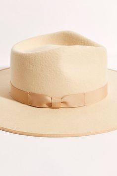 Top things off with this structured Australian wool hat featured in a round brim design with a ribbon on the crown. **Features:** Australian wool fabrication, round brim style, dipped crown, ribbon band, interior band for secure fit **Why We | Rancher Felt Hat by Lack of Color at Free People in White, Size: L Spring Wide Brim Fur Felt Hat, Wool Flat Brim Fedora For Spring, Chic Wool Brimmed Fedora, Chic Wool Fedora, Chic Wide Brim Wool Fedora, Elegant Fur Felt Panama Hat For Fall, Chic Wool Felt Hat With Flat Brim, Wool Wide Brim Hat For Spring, Spring Wool Felt Hat With Flat Brim